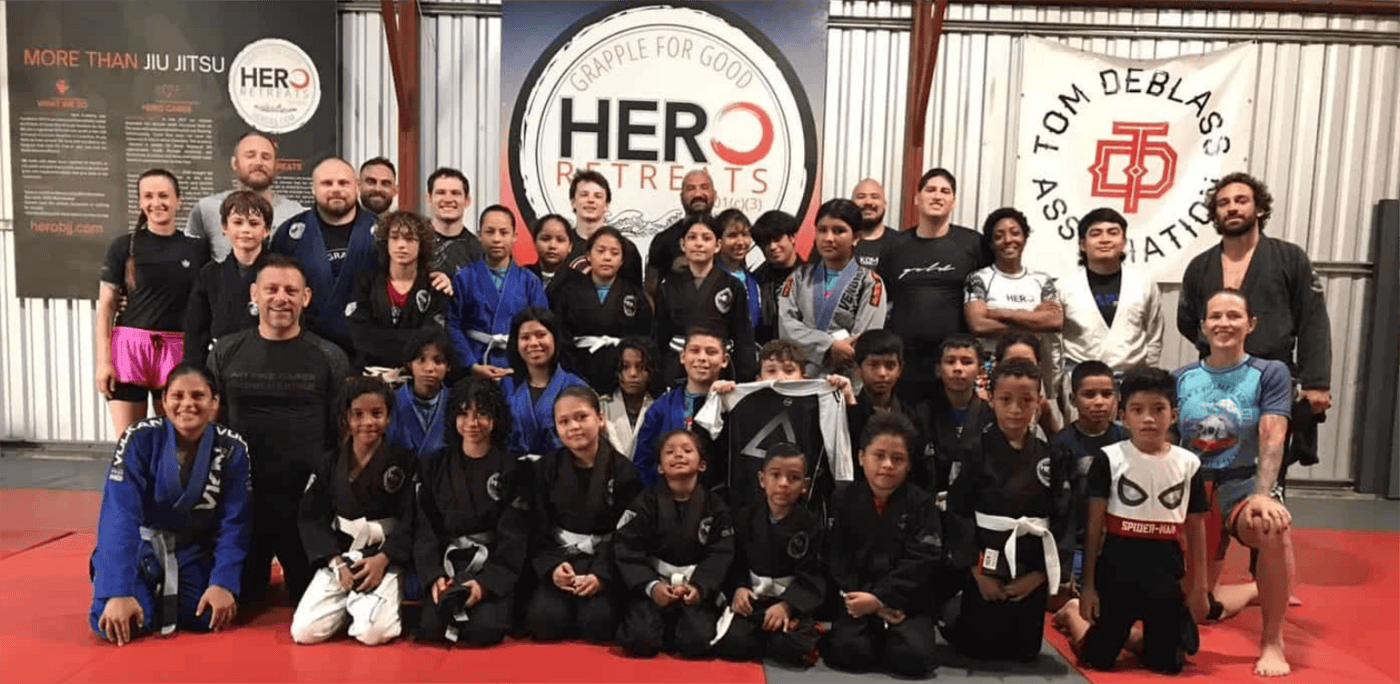 Hero Kids class practicing Brazilian Jiu-Jitsu at free youth program in Tamarindo